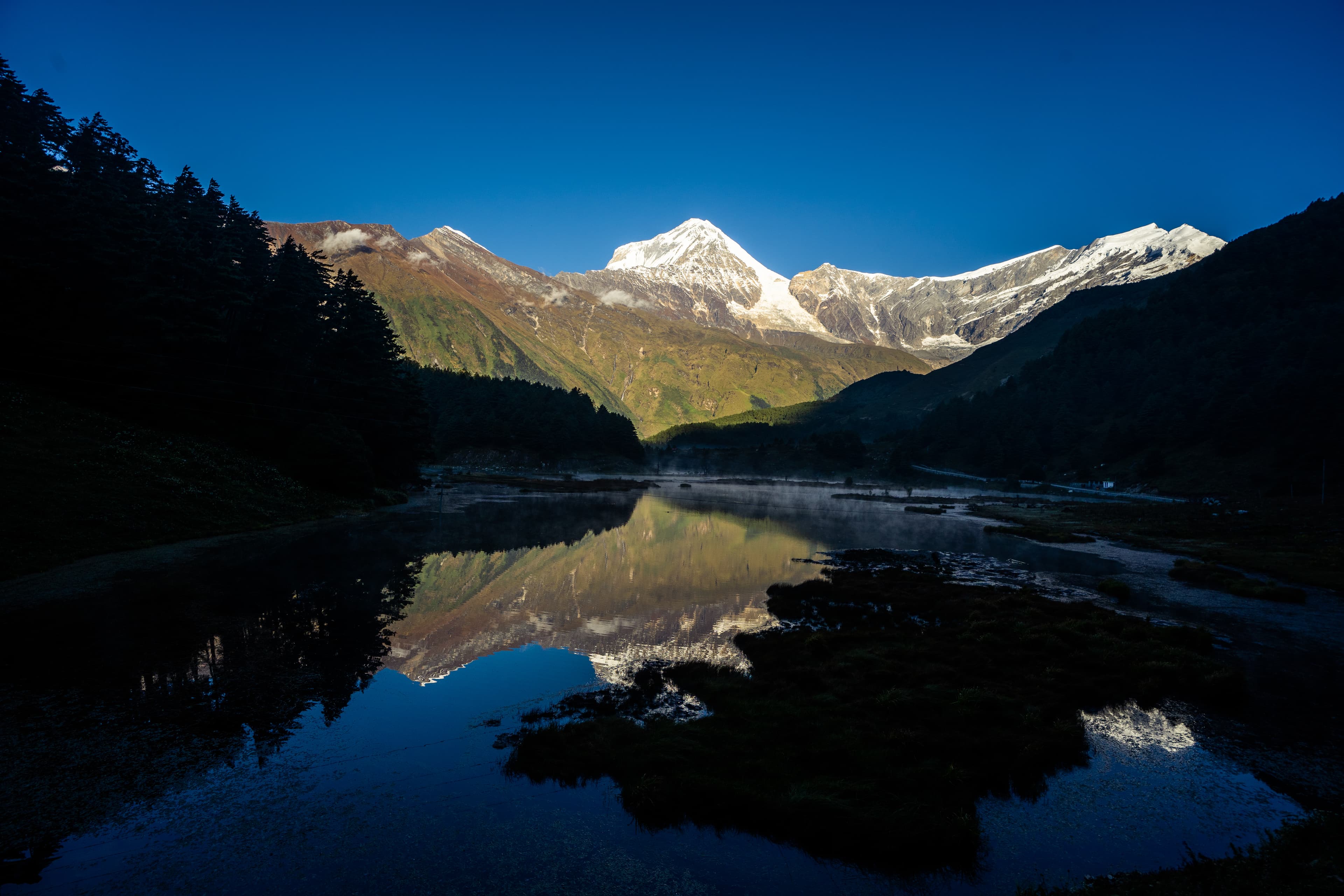 Dawn reflection on a glacial lake